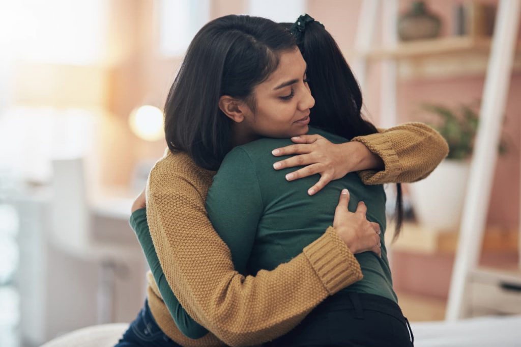 My friend was laid off from our company, but I wasn’t. How should I console her?