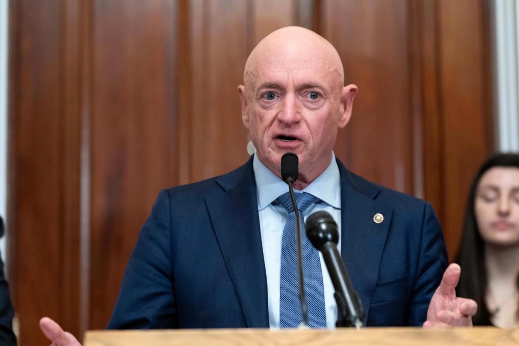 Sen. Mark Kelly, D-Ariz., speaks during a news conference as he introduces a Tax Bill at the Capitol Thursday, March 12, 2026, in Washington. (AP Photo/Jose Luis Magana)