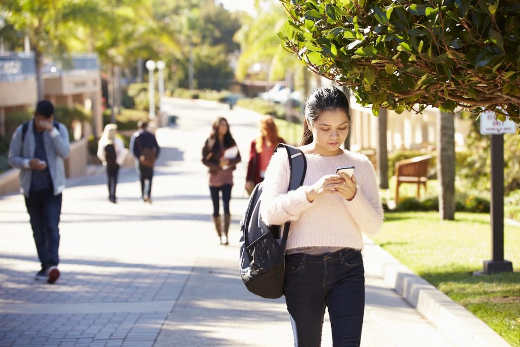 Female student walking on University Campus