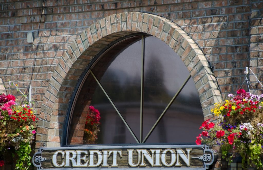 Credit Union Student Loans: Guide To Direct vs. Partner Programs Window of a credit union | Source: The College Investor