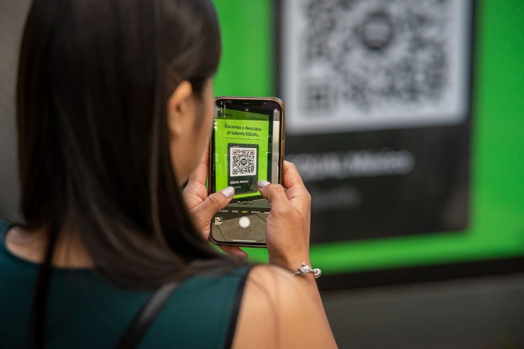Every QR code hides three larger squares in its corners — they let a scanner find the code at any angle, and the pattern also carries enough redundancy to still read after roughly 30 per cent of the code is damaged or covered