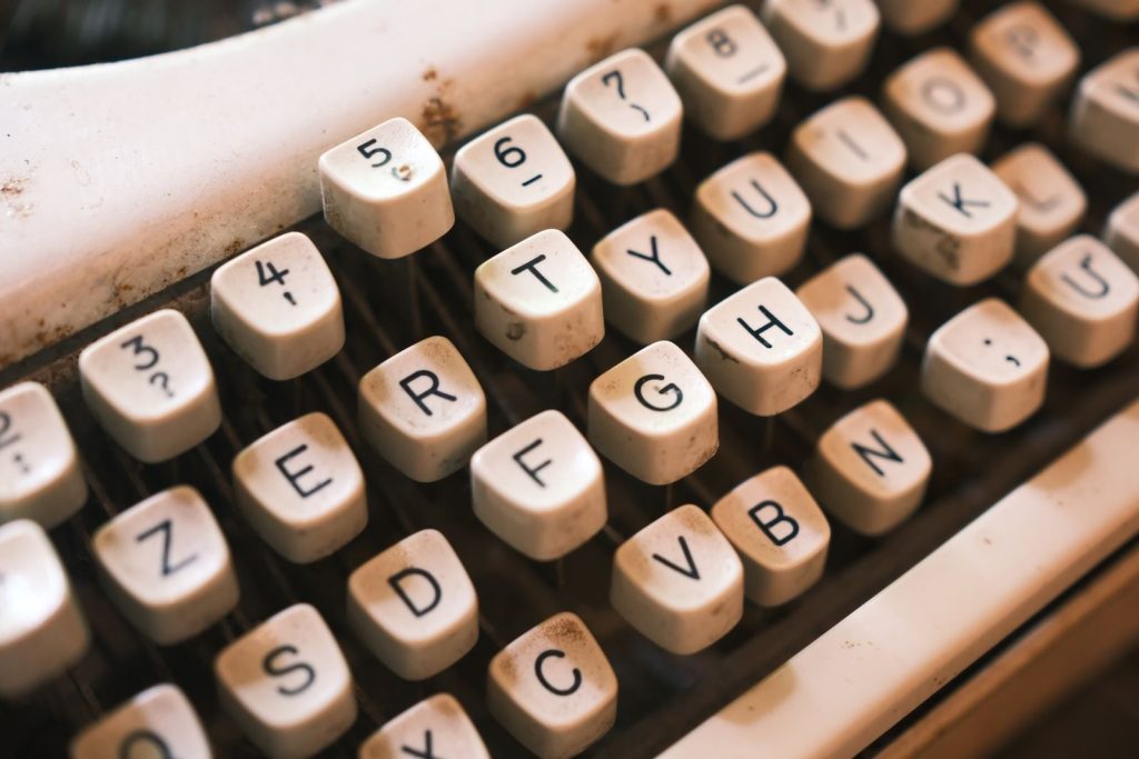 Why did the QWERTY keyboard, arranged in the 1870s to stop mechanical typebars from jamming, outlast every layout designed to beat it over the next 150 years?