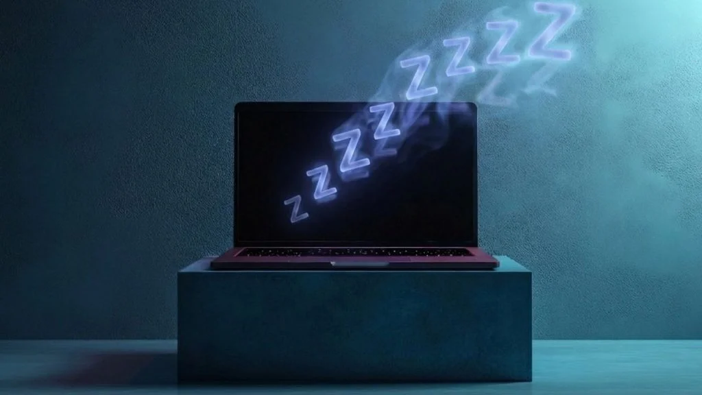 A laptop on sleep in dark elevated area with sleep visuals on it